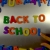 Hand Writes Back to School with Fridge Magnets