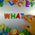 Hand Writes What with Fridge Magnets