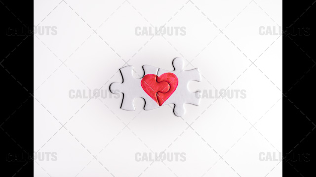 Heart Puzzle Final Pieces Together on White Top-Down
