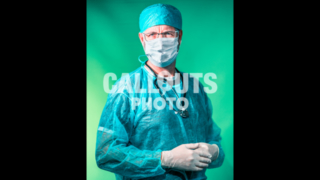 Doctor Looking into Camera with Concerned Expression, Protective Face Mask
