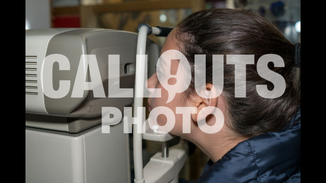 Young Teenage Girl in Eye Exame Checking Eye Vision with Machine