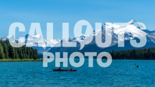 Canoes on Maligne Lake, Mountains and Forest